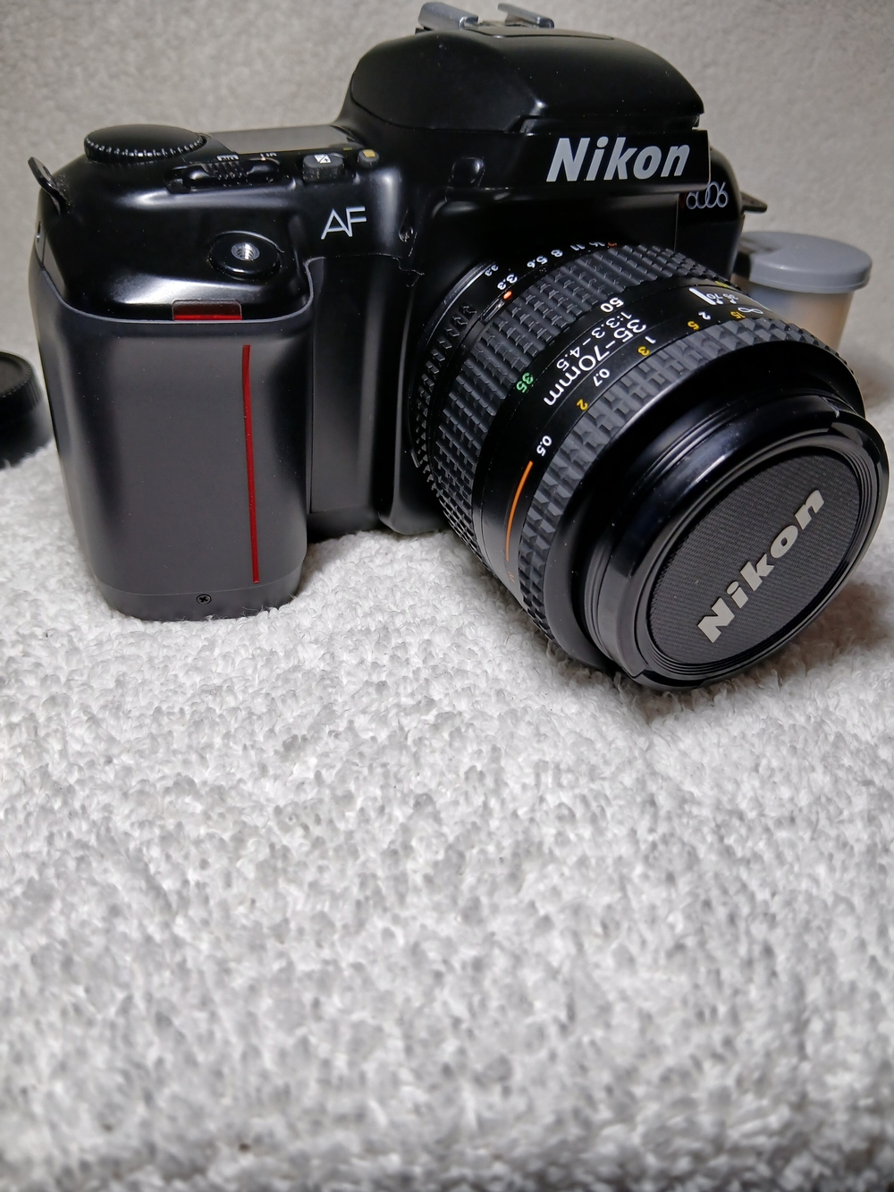 Nikon N6006 35mm autofocus SLR film camera. With Extra Lens and 2 Rolls Of Film.